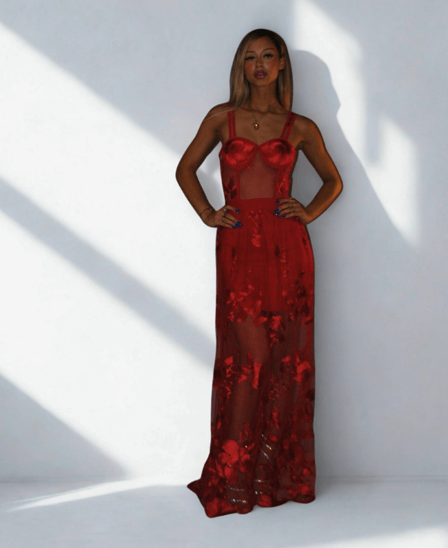 
                      
                        Elegante avondjurk met bloemenprint en transparante zoom - achterkant

                      
                    